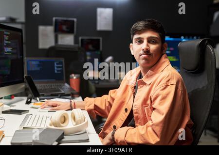 Portrait of Asian Man Working as Software Developer in Office Stock Photo