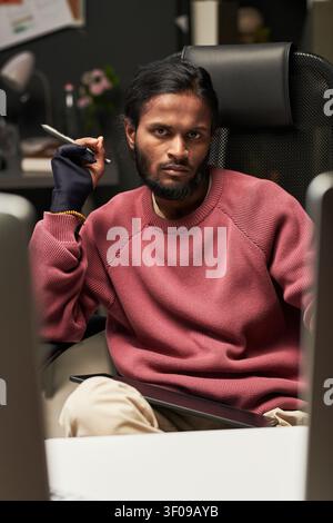 Portrait of Indian Man Using Stylus in Creative Office Stock Photo