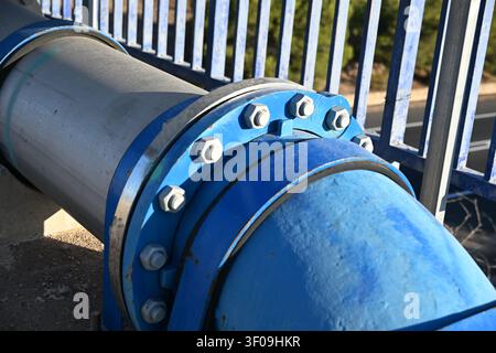 Close Up of Blue Steel Fittings and Connections on a Large Water Pipeline Stock Photo