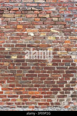 Grunge brick wall in portrait format - architecture background Stock Photo