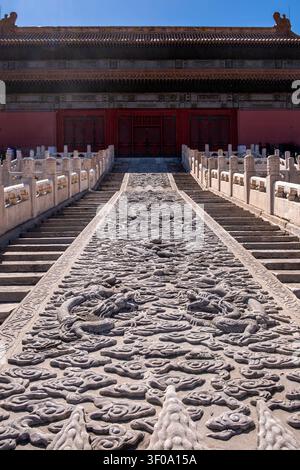 Carved dragon ramp and stone stairs lead to Supreme Harmony in Forbidden City, Beijing, China, under blue sky on a spring day Stock Photo