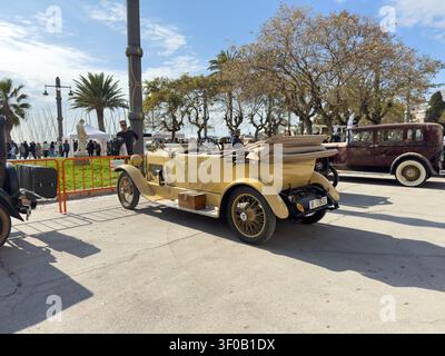 Sitges, Spain - March 01, 2026: An elegant yellow vintage convertible with a folded soft top on display during the Barcelona-Sitges International Anti Stock Photo