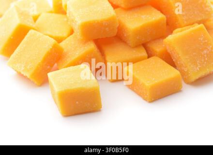 Close up of natural candied mango dices  on white background Stock Photo