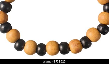 black and brown wooden bead bracelet isolated white background, alternating round natural and painted dark beads handmade jewelry accessory in macro Stock Photo
