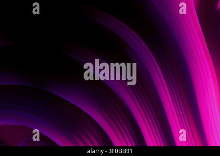 Dynamic abstract 3D composition with flowing fuchsia and purple gradient wave lines. High contrast against a black background. Ideal for tech, fashion Stock Photo
