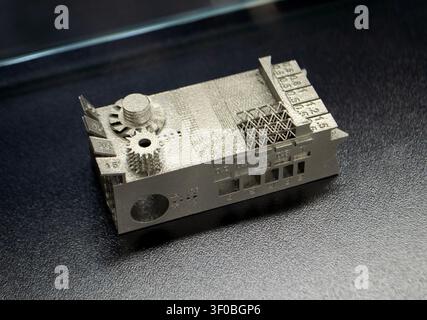 Small object metal calibration model printed on 3D printer. Detailed model printed on 3D printer from metal powder. Selective Laser Melting technologies SLM. Additive modern manufacturing. 3D printing Stock Photo