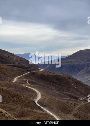 Winding mountain road through the rugged landscape of Dagestan, Russia Stock Photo