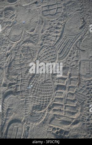 Shoe prints in sand Stock Photo