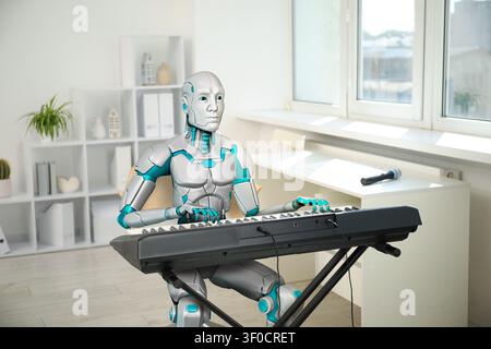 Music creation with artificial intelligence. Robot playing electric piano indoors Stock Photo