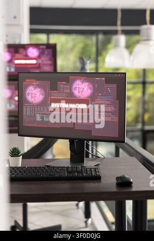 Contemporary office workspace stands empty as computer screens display system hacked messages. Visual concept emphasizes cyber threats, IT failures, and the need for strong digital protection. Stock Photo
