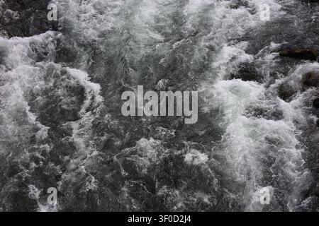 Overhead View of Rushing White Water Rapids and Troubled River Currents Stock Photo