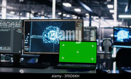 Isolated screen laptop in server room used for AI development and machine learning coding. Stock Photo