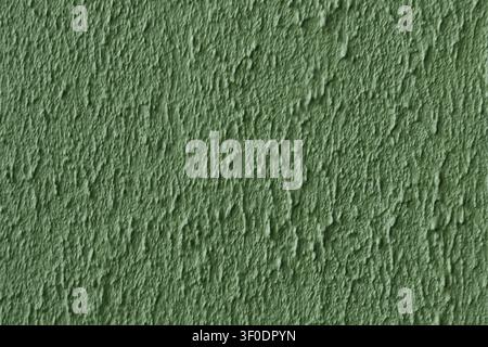 The wall is painted in a light green color. The wall has a rough texture and he is made of cement Stock Photo