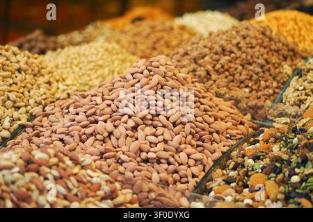 Colorful display of nuts and fruits in a vibrant market Stock Photo