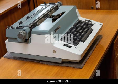 Close view of a vintage typewriter displayed on a desk at the Berlin Stasi Museum in Berlin, Germany. Stock Photo