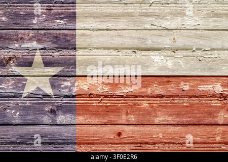 The flag of the state of Texas with the texture of old wooden boards. Flag with the texture of rough boards. Stock Photo