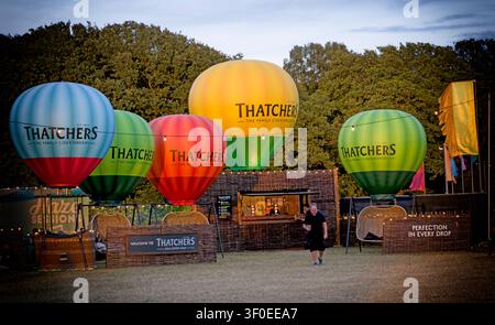 Thatchers cider bar with colourful branded balloon decorations at Silverstone Circuit, Northamptonshire, England, UK. Stock Photo