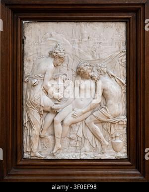 Berlin, Germany - 23 May 25: Marble relief with classical figures in a dark wooden frame displayed at the Bode Museum in Berlin, Germany. Stock Photo