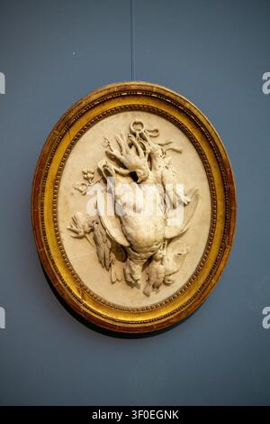 Berlin, Germany - 23 May 25: Oval marble relief showing a hanging game bird arrangement displayed at the Bode Museum in Berlin, Germany. Stock Photo