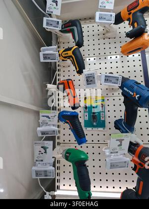 DENIA, SPAIN - October 5, 2025. Drills from multiple brands are arranged on a store display in Spain. Each tool has a price tag attached, showcasing o Stock Photo