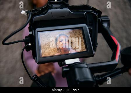 Black Man Appearing on Camera Screen for Video Content Creation Stock Photo