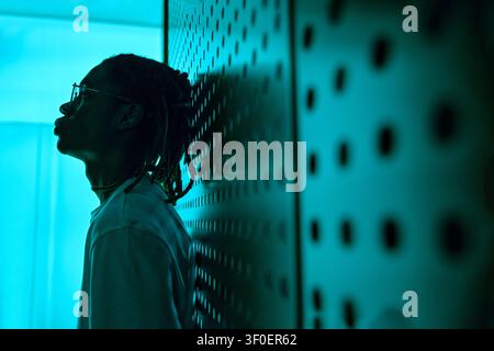 Black Adult Man Standing in Futuristic Office Technology Setting Stock Photo
