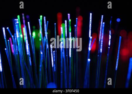 Colorful vertical light lines representing diverse connections, global communication, and modern business networks in a digital environment. Stock Photo