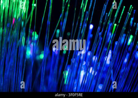 Colorful vertical light lines representing diverse connections, global communication, and modern business networks in a digital environment. Stock Photo
