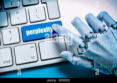 Robot hand with binary code presses key labeled perplexity on a computer keyboard, photomontage Stock Photo
