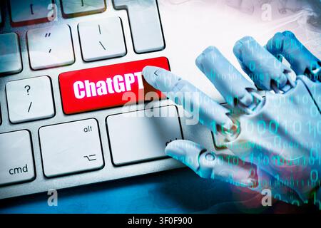Robot hand with binary code presses key labeled ChatGPT on a computer keyboard, photomontage Stock Photo