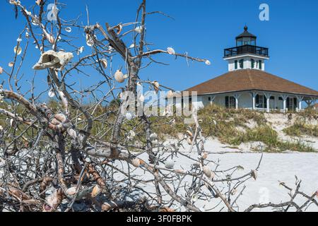 The Port Boca Grande lighthouse on Gasparilla Island, an island in the Gulf of Mexico in southwest Florida. In the foreground, the protected dune land Stock Photo