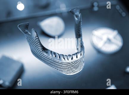 Object custom jaw printed on 3D printer from titanium. Model lower jaw printed 3D printer from metal powder. Selective Laser Melting. SLM. Additive new modern manufacturing. 3D printing technology Stock Photo