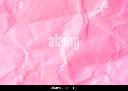 Pink crumpled paper texture background. Stock Photo