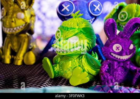 Different colorful toys printed on 3D printer. Art models printed on 3D printer from molten plastic. FDM technology. Fused Deposition Modeling. Additive modern manufacturing technology. 3D printing Stock Photo