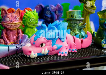 Different colorful toys printed on 3D printer. Art models printed on 3D printer from molten plastic. FDM technology. Fused Deposition Modeling. Additive modern manufacturing technology. 3D printing Stock Photo