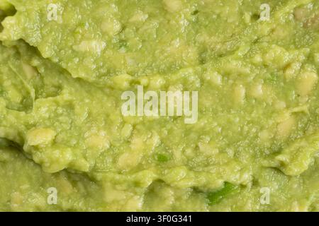 Abstract food background of fresh mashed avocado texture Stock Photo