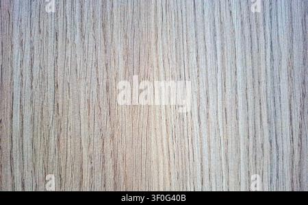 This close-up view showcases a smooth wood laminate texture with light natural grains. It highlights the subtle variations and patterns found in wood, Stock Photo