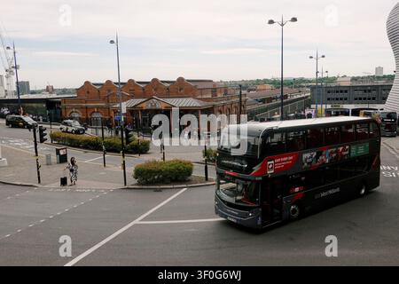 High-angle view of a double-decker bus on a junction by the historic Birmingham Moor Street station, UK Stock Photo