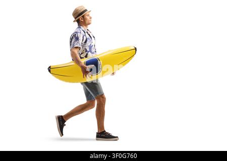 Man carrying a banana shaped pool float isolated on white background Stock Photo