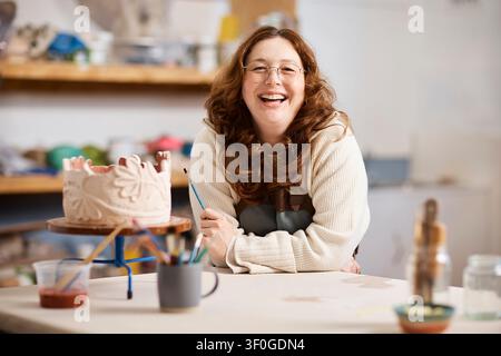Smiling Female Potter In Pottery Studio Portrait - Small Business Owner And Creative Artist Stock Photo