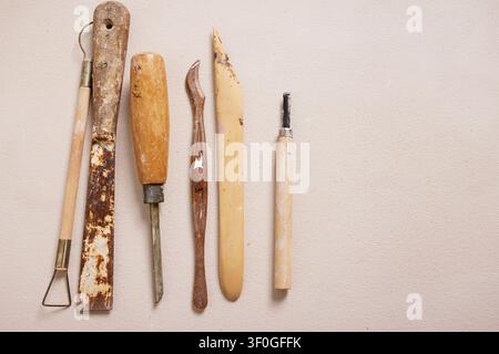 Pottery Tools and Clay Modeling Implements Laid Out in a Pottery Studio Workspace Stock Photo