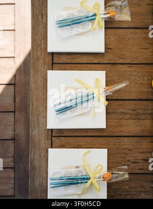 Paint party art kits with canvases and brushes on wooden table Stock Photo