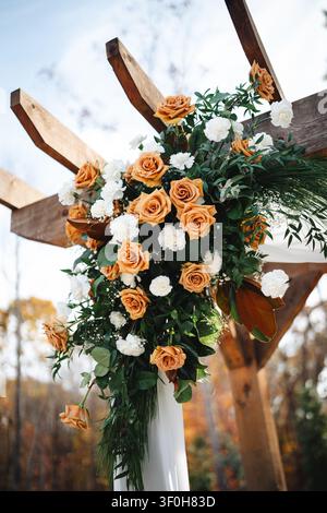 Autumn wedding floral arrangement on wooden pergola Stock Photo