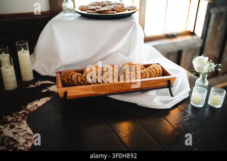 Assorted cookies in wooden tray at elegant dessert buffet Stock Photo