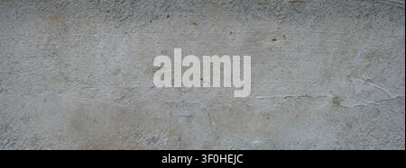 Horizontal close up of a concrete barrier block surface with a flat, uneven, rough unfinished cement texture Stock Photo