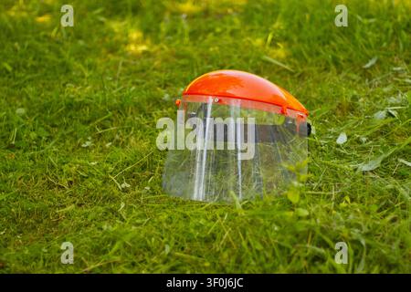 Protective face shield on grass Stock Photo