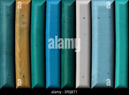 Full frame macro of vertical wooden planks with beveled edges, painted in textured shades of blue, teal, green, white, and yellow. Stock Photo