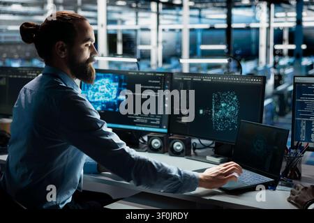 Server room system administrator running simulations for AI driven prediction, tracking performance. Stock Photo