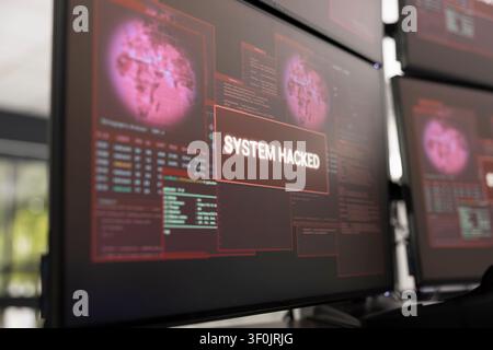 Closeup of computer monitor showing security breach alert. The warning indicates malicious program has penetrated firewall, highlighting risks of hacking, and need for robust cybersecurity measures. Stock Photo