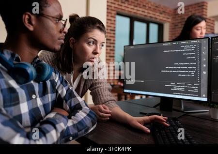 High tech engineer encrypts platform information through peer file sharing while updating cloud files with advanced compression algorithms. Stock Photo